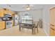 Bright kitchen with stainless steel appliances, breakfast nook, and tile flooring at 129 Lakepointe Ct, Stockbridge, GA 30281