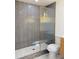 Modern bathroom featuring tiled shower with glass enclosure, updated fixtures, and a new toilet at 2094 Shamrock Dr, Decatur, GA 30032