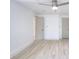 Bright, airy bedroom featuring vinyl floors, ceiling fan, neutral colors, and multiple doors at 2094 Shamrock Dr, Decatur, GA 30032