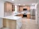 Modern kitchen with stainless appliances, quartz counters, and hardwood floors at 2094 Shamrock Dr, Decatur, GA 30032