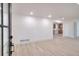 Bright and spacious living room featuring light wood floors and freshly painted white walls at 2094 Shamrock Dr, Decatur, GA 30032