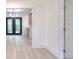 Open-concept living room with views to the dining and kitchen area and light wood flooring at 2094 Shamrock Dr, Decatur, GA 30032