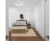 Calm bedroom with neutral tones, soft lighting, and a cozy rug at 308 Chardonnay Way, Woodstock, GA 30188