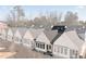Exterior of modern townhomes with white siding and black roof shingles at 308 Chardonnay Way, Woodstock, GA 30188