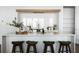 Bright kitchen featuring a spacious island with seating and contemporary design at 308 Chardonnay Way, Woodstock, GA 30188