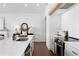 Bright kitchen with white countertops, modern appliances, and natural wood accents at 308 Chardonnay Way, Woodstock, GA 30188