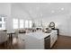 Bright open-concept living area and kitchen, hardwood floors, and plenty of natural light at 308 Chardonnay Way, Woodstock, GA 30188
