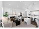 Bright living room featuring a fireplace, modern furniture, and an open floor plan at 308 Chardonnay Way, Woodstock, GA 30188