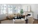 Comfortable living room featuring neutral tones, modern furniture, and natural light at 308 Chardonnay Way, Woodstock, GA 30188