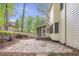 Well-manicured backyard featuring a stone patio area and screened-in porch at 3761 Bays Ferry Way, Marietta, GA 30062