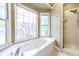 Bright bathroom with tub and separate glass shower, next to a large garden tub at 3761 Bays Ferry Way, Marietta, GA 30062