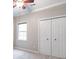 Bedroom featuring a double door closet, neutral carpet, and paint at 3761 Bays Ferry Way, Marietta, GA 30062