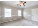 Bedroom with plush neutral carpeting, crown molding and a ceiling fan at 3761 Bays Ferry Way, Marietta, GA 30062