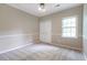 Bedroom with neutral carpet, paint, and a double door closet at 3761 Bays Ferry Way, Marietta, GA 30062