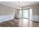 Bright dining area featuring wainscoting detail, wood-look floors, and bay window at 3761 Bays Ferry Way, Marietta, GA 30062