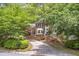 Charming two-story brick home with mature landscaping and a curved driveway at 3761 Bays Ferry Way, Marietta, GA 30062