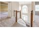 Hallway with staircase leading to the front door and chandelier at 3761 Bays Ferry Way, Marietta, GA 30062
