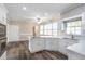 Bright kitchen features white cabinets, stainless steel appliances, and wood-look flooring at 3761 Bays Ferry Way, Marietta, GA 30062