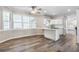 Open-concept kitchen with white cabinetry, an island, and lots of natural light at 3761 Bays Ferry Way, Marietta, GA 30062