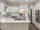 Updated kitchen featuring white cabinets, subway tile backsplash, and stainless steel appliances at 3761 Bays Ferry Way, Marietta, GA 30062