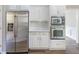 Bright kitchen features stainless steel refrigerator and matching oven at 3761 Bays Ferry Way, Marietta, GA 30062