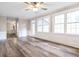 Sunlit living room features classic wainscoting and wood-look floors at 3761 Bays Ferry Way, Marietta, GA 30062