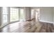 Sunlit living room showcasing wood-look floors and a bay window, great for entertaining at 3761 Bays Ferry Way, Marietta, GA 30062