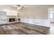 Living room features a fireplace, built in shelves, and wood-look floors at 3761 Bays Ferry Way, Marietta, GA 30062