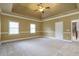 Spacious main bedroom with trey ceiling, ceiling fan, and carpeting at 3761 Bays Ferry Way, Marietta, GA 30062