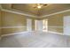 Large main bedroom with trey ceiling, carpet flooring, and lots of natural light at 3761 Bays Ferry Way, Marietta, GA 30062