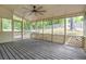 Cozy screened-in porch with wood decking and views of the wooded backyard at 3761 Bays Ferry Way, Marietta, GA 30062
