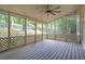 Inviting screened-in porch with wood decking and views of the wooded backyard at 3761 Bays Ferry Way, Marietta, GA 30062