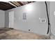 Unfinished basement with concrete floor, grey walls, and access door provides plenty of space at 3929 Emerald Springs Ct, Decatur, GA 30035