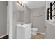 Bathroom features a white vanity and toilet with neutral walls and a modern mirror at 3929 Emerald Springs Ct, Decatur, GA 30035