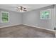 A spacious bedroom with plush carpeting and large windows providing natural light at 3929 Emerald Springs Ct, Decatur, GA 30035