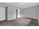 Bedroom featuring neutral walls, carpeting, a closet, and a ceiling light at 3929 Emerald Springs Ct, Decatur, GA 30035