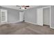A spacious bedroom featuring plush carpeting and a large closet for ample storage at 3929 Emerald Springs Ct, Decatur, GA 30035