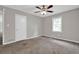 Bedroom with neutral walls, carpeting, a window, and a ceiling fan at 3929 Emerald Springs Ct, Decatur, GA 30035