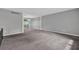 Neutral living room with gray walls and a large window providing natural light at 3929 Emerald Springs Ct, Decatur, GA 30035
