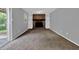 Living room featuring a brick fireplace and built-in shelves at 3929 Emerald Springs Ct, Decatur, GA 30035