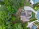 Aerial shot showing the home's roof, backyard, and surrounding landscaping at 1008 Stream Valley Ct, Alpharetta, GA 30022