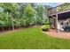 Beautiful backyard featuring lush lawn, privacy fence, and a deck at 1008 Stream Valley Ct, Alpharetta, GA 30022