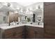 Bathroom featuring double sinks with a large countertop and undermount cabinetry at 1008 Stream Valley Ct, Alpharetta, GA 30022