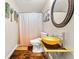 Well-lit bathroom with vessel sink and modern fixtures at 1008 Stream Valley Ct, Alpharetta, GA 30022