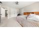 Bedroom features neutral tones, carpeted floors, and a built-in headboard, offering a serene and inviting atmosphere at 1008 Stream Valley Ct, Alpharetta, GA 30022