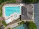 Overhead photograph of a large community pool, clubhouse and tennis courts at 1008 Stream Valley Ct, Alpharetta, GA 30022