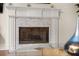 Elegant fireplace with a marble surround and glass screen, perfect for cozy evenings at 1008 Stream Valley Ct, Alpharetta, GA 30022