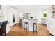 Large kitchen with white cabinets, stainless appliances, hardwood floors, and ample counter space at 1008 Stream Valley Ct, Alpharetta, GA 30022