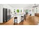 Spacious kitchen featuring a large island with counter seating, stainless steel appliances, and ample cabinets at 1008 Stream Valley Ct, Alpharetta, GA 30022