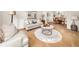 Comfortable living room with neutral tones, large windows, and a view into the dining room at 1008 Stream Valley Ct, Alpharetta, GA 30022